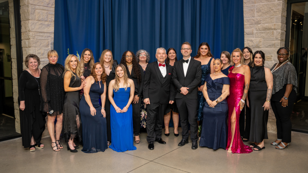 Riordan Clinic staff gathered at the 50th Anniversary Gala at Mark Arts in Wichita, Kansas, April 2026